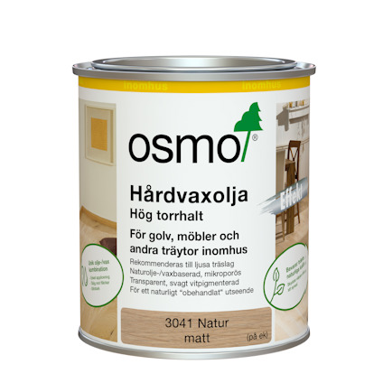 Plåtburk med Osmo hårdvaxolja, etikett innehåller text om produktens användning för inomhus träytor, med fokus på trägolv och möbler.